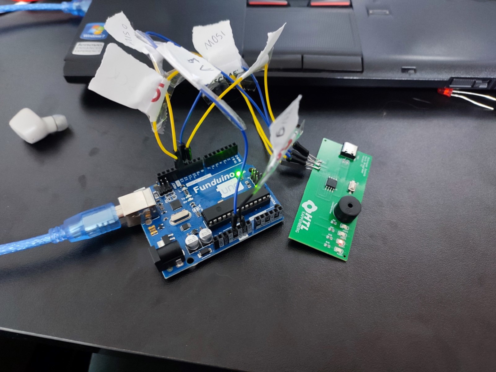 The First Prototype Board connected to an Arduino UNO, which is the programmer